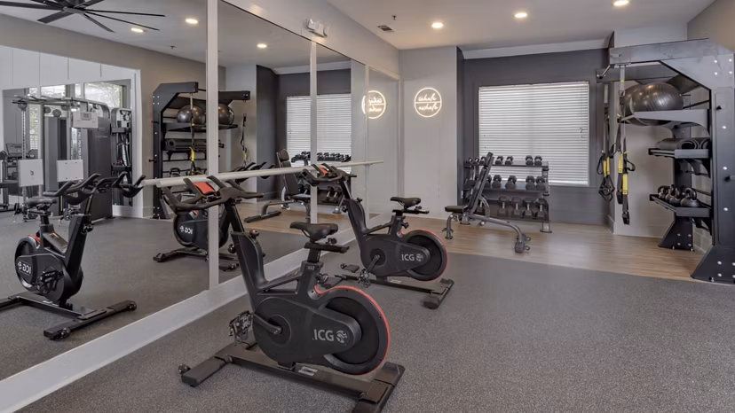 Fitness center featuring modern exercise equipment at The Slate Apartments