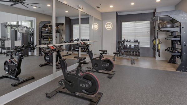Fitness center featuring modern exercise equipment at The Slate Apartments