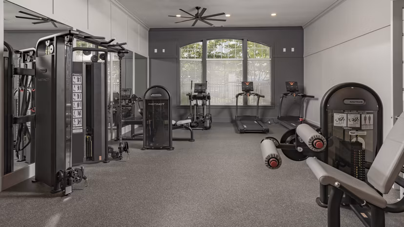 Fully-equipped fitness center with modern machines at The Slate Apartments