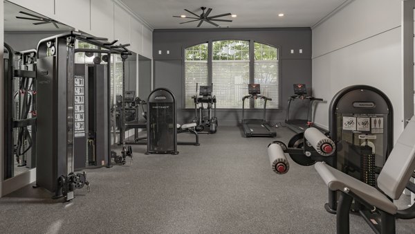 Fully-equipped fitness center with modern machines at The Slate Apartments