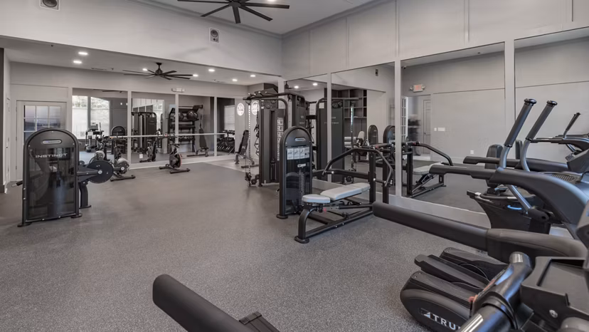 State-of-the-art fitness center featuring modern equipment at The Slate Apartments