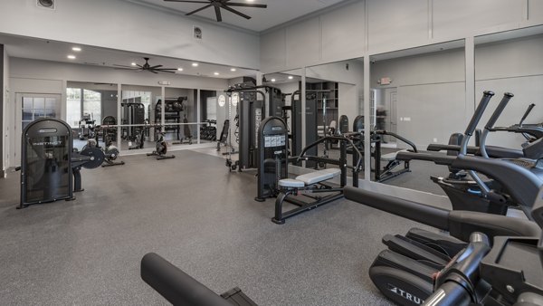 State-of-the-art fitness center featuring modern equipment at The Slate Apartments