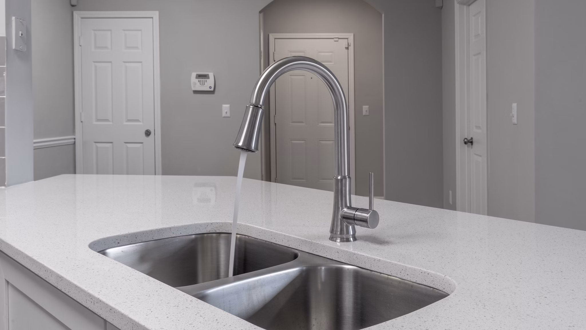 Modern kitchen with stainless steel appliances at The Slate Apartments