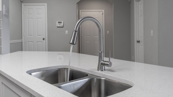 Modern kitchen with stainless steel appliances at The Slate Apartments