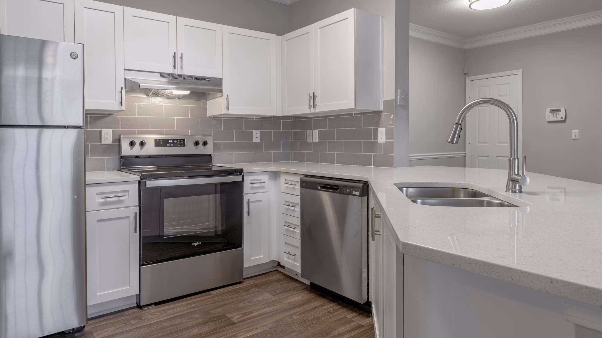 Modern kitchen with stainless steel appliances at The Slate Apartments