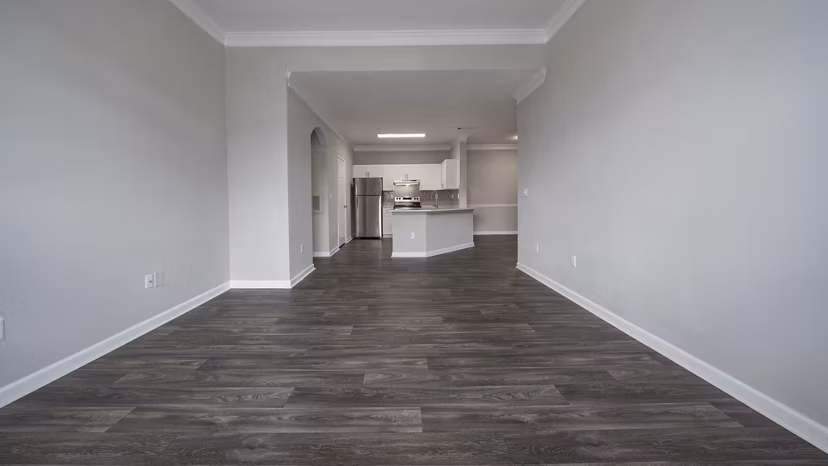 Living room featuring cozy seating and large windows in The Slate Apartments, luxury living by Greystar in a desirable location