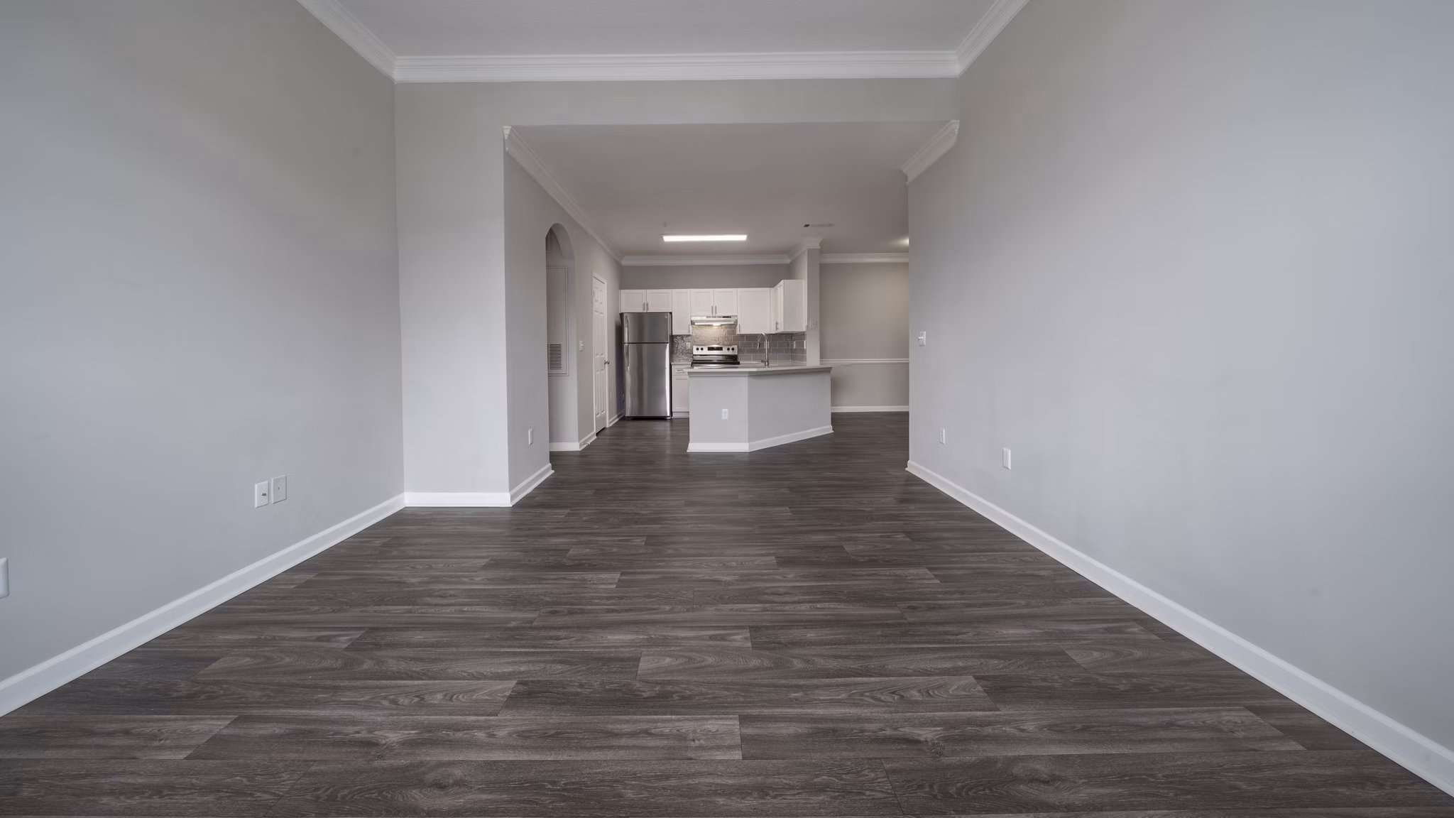 Living room featuring cozy seating and large windows in The Slate Apartments, luxury living by Greystar in a desirable location