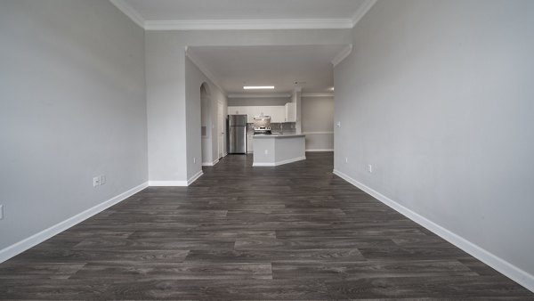 Living room featuring cozy seating and large windows in The Slate Apartments, luxury living by Greystar in a desirable location