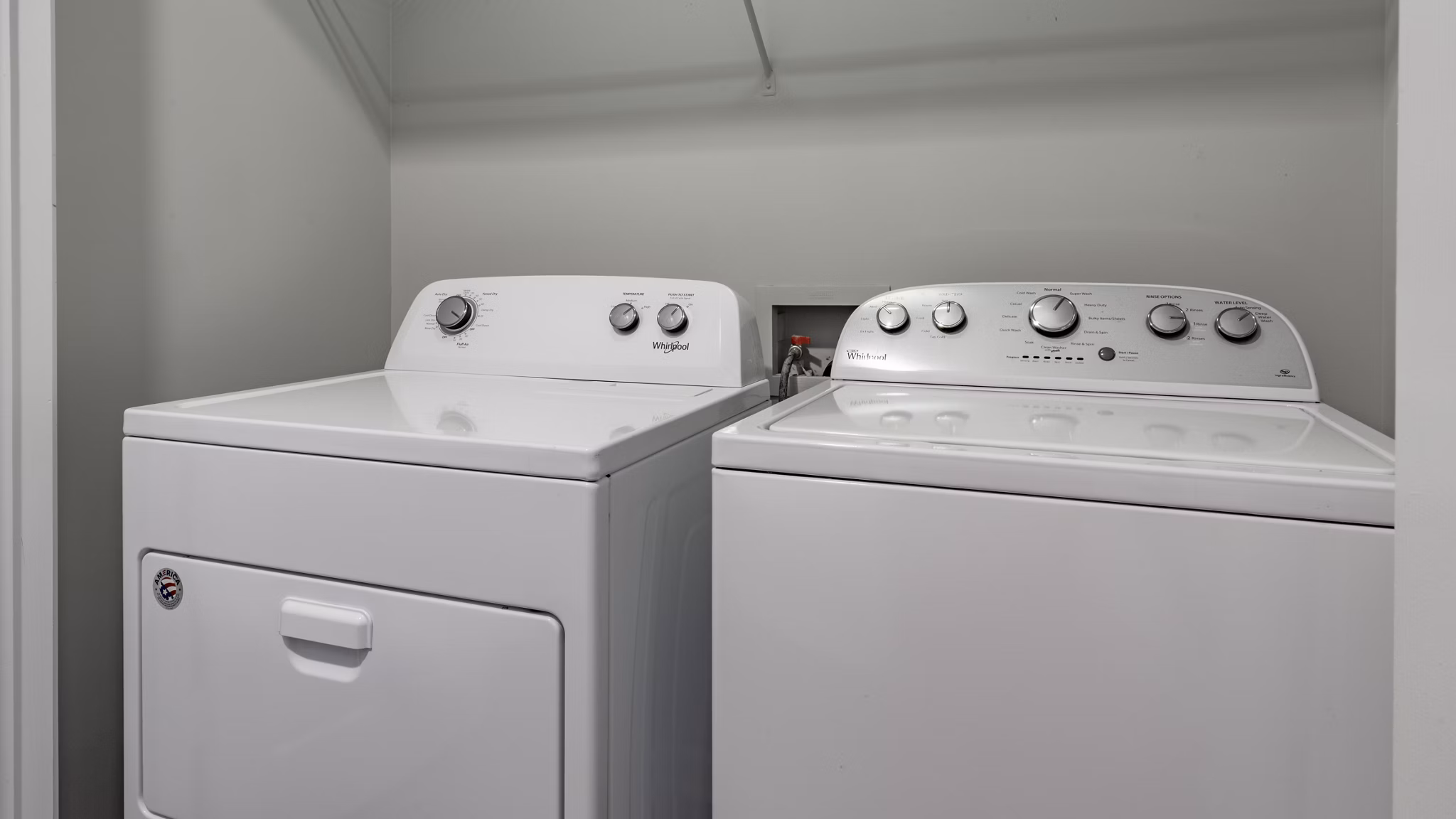 Laundry room with modern appliances in The Slate Apartments, a Greystar luxury community
