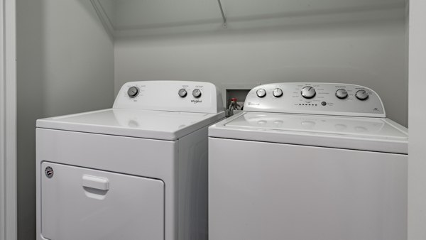 Laundry room with modern appliances in The Slate Apartments, a Greystar luxury community