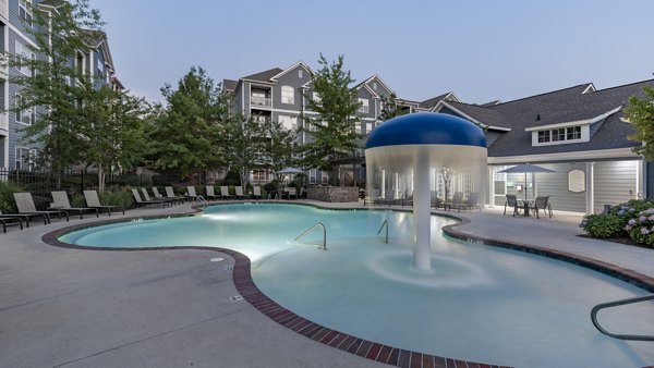 Infinity pool with city skyline views at The Slate Apartments