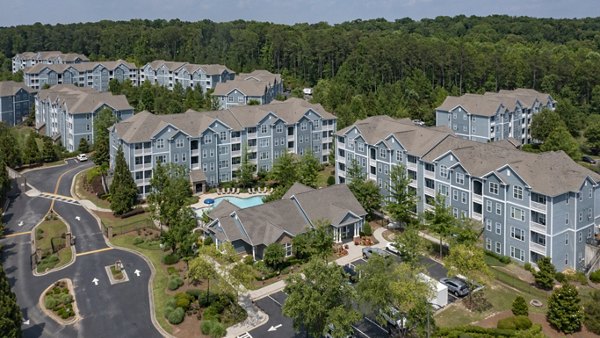 The Slate Apartments: Stunning outdoor view at luxury complex featuring lush green spaces