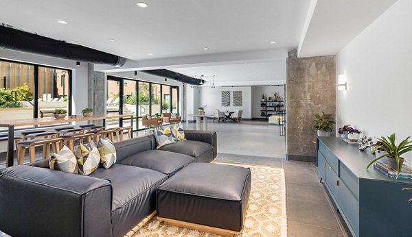 Clubhouse featuring modern seating and vibrant decor at Ann Street Lofts Apartments, offering inviting spaces for socializing and relaxation