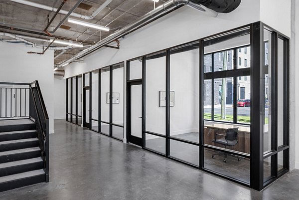 Home office with modern furnishings at Ann Street Lofts Apartments