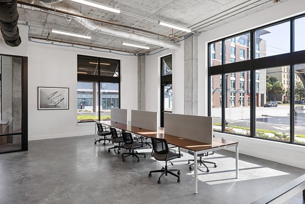 Home office with modern decor and ample natural light at Ann Street Lofts Apartments