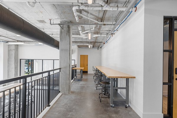 Home office with modern dÃ©cor and natural light at Ann Street Lofts Apartments, luxury living space in urban setting