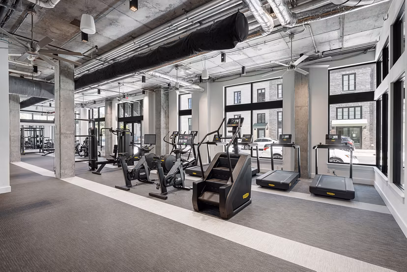 State-of-the-art fitness center with modern equipment at Ann Street Lofts Apartments, offering a comprehensive workout experience
