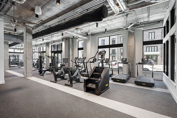 State-of-the-art fitness center with modern equipment at Ann Street Lofts Apartments, offering a comprehensive workout experience