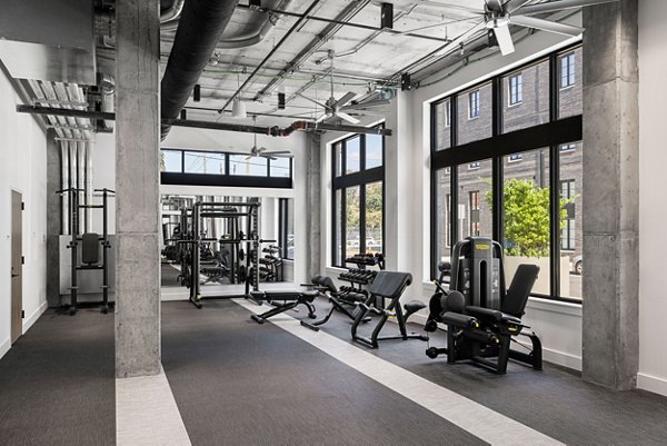 State-of-the-art fitness center with various equipment at Ann Street Lofts Apartments for active living