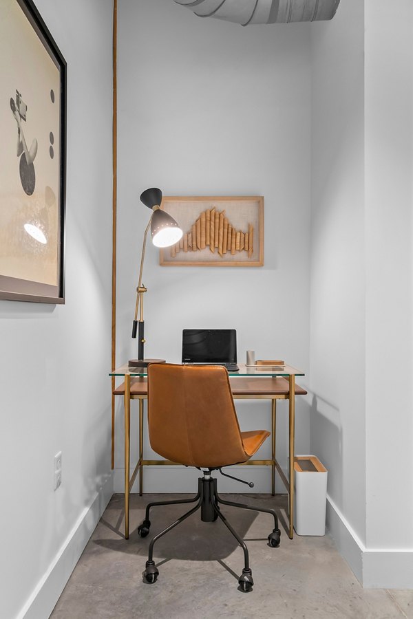 Modern living room with cozy seating and stylish decor in Ann Street Lofts Apartments