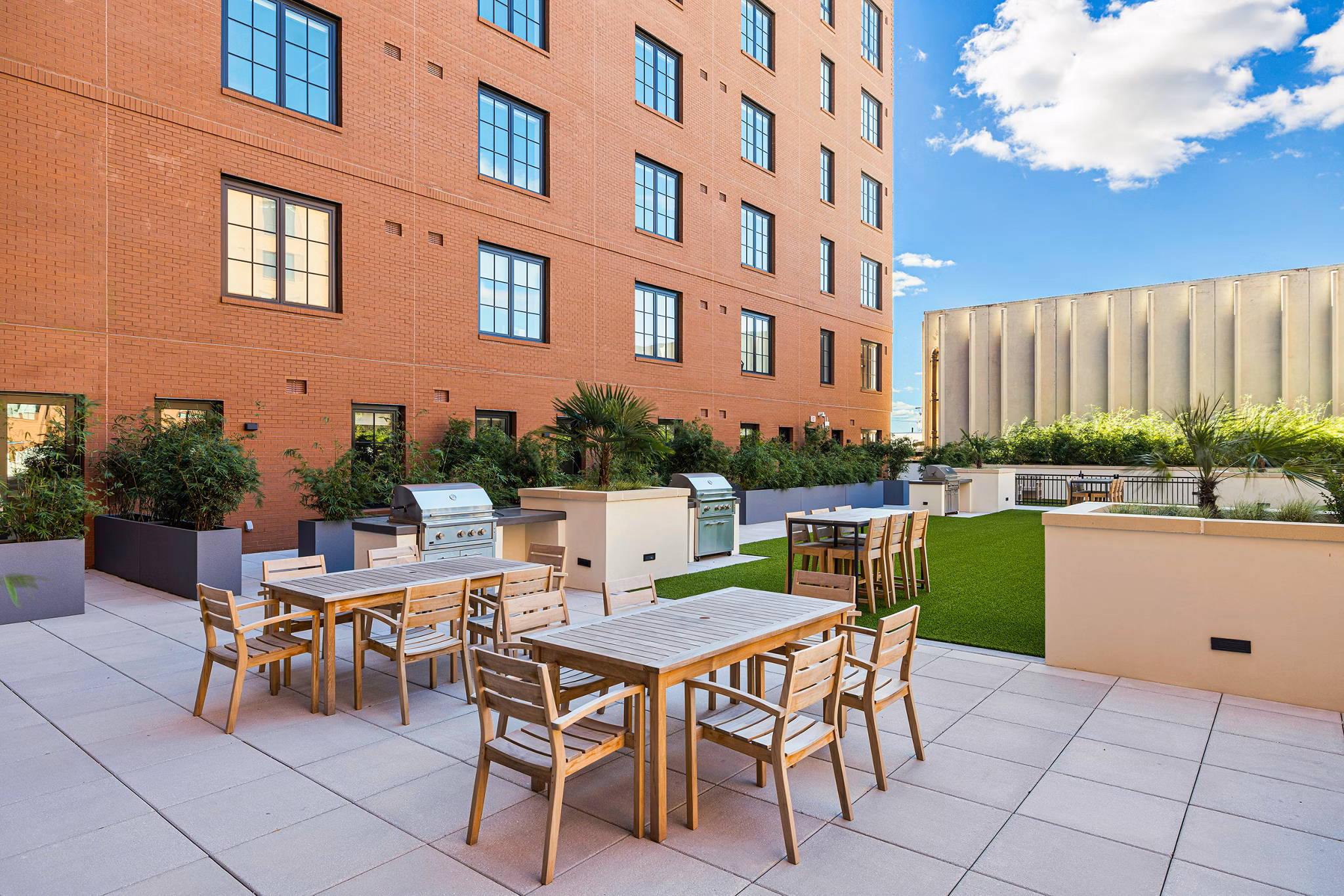 Stylish outdoor patio with seating at Ann Street Lofts Apartments