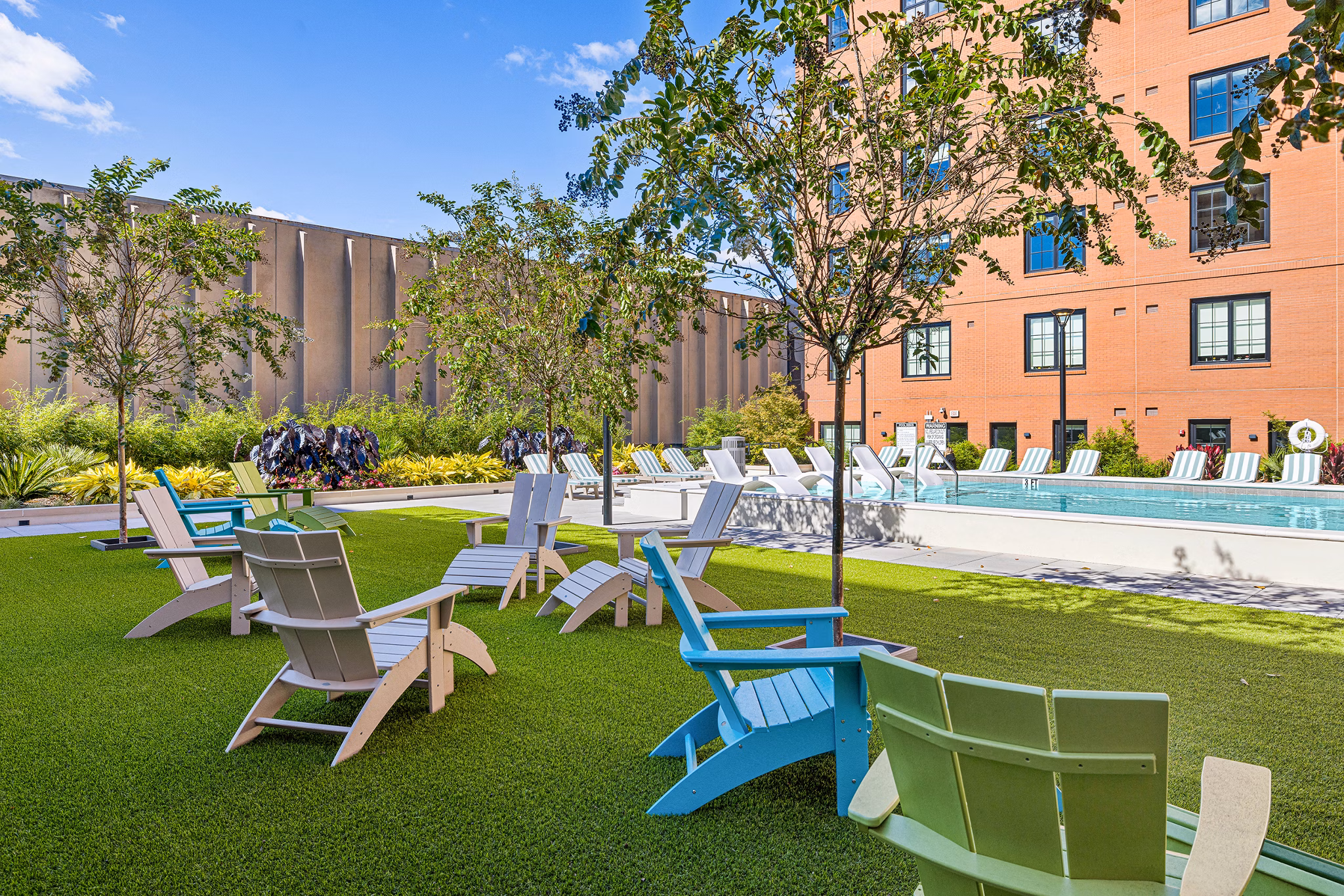 Chic patio with modern seating at Ann Street Lofts Apartments, perfect for relaxing outdoor gatherings in a luxury setting