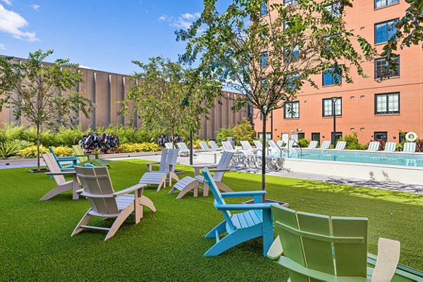 Chic patio with modern seating at Ann Street Lofts Apartments, perfect for relaxing outdoor gatherings in a luxury setting