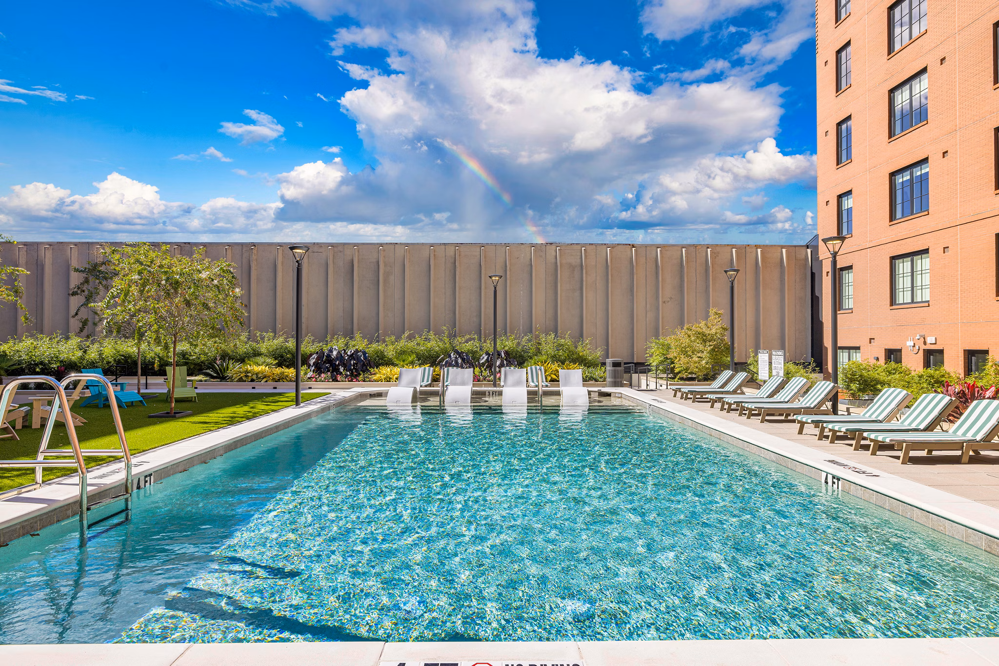 Rooftop infinity pool at Ann Street Lofts Apartments offering luxury urban relaxation