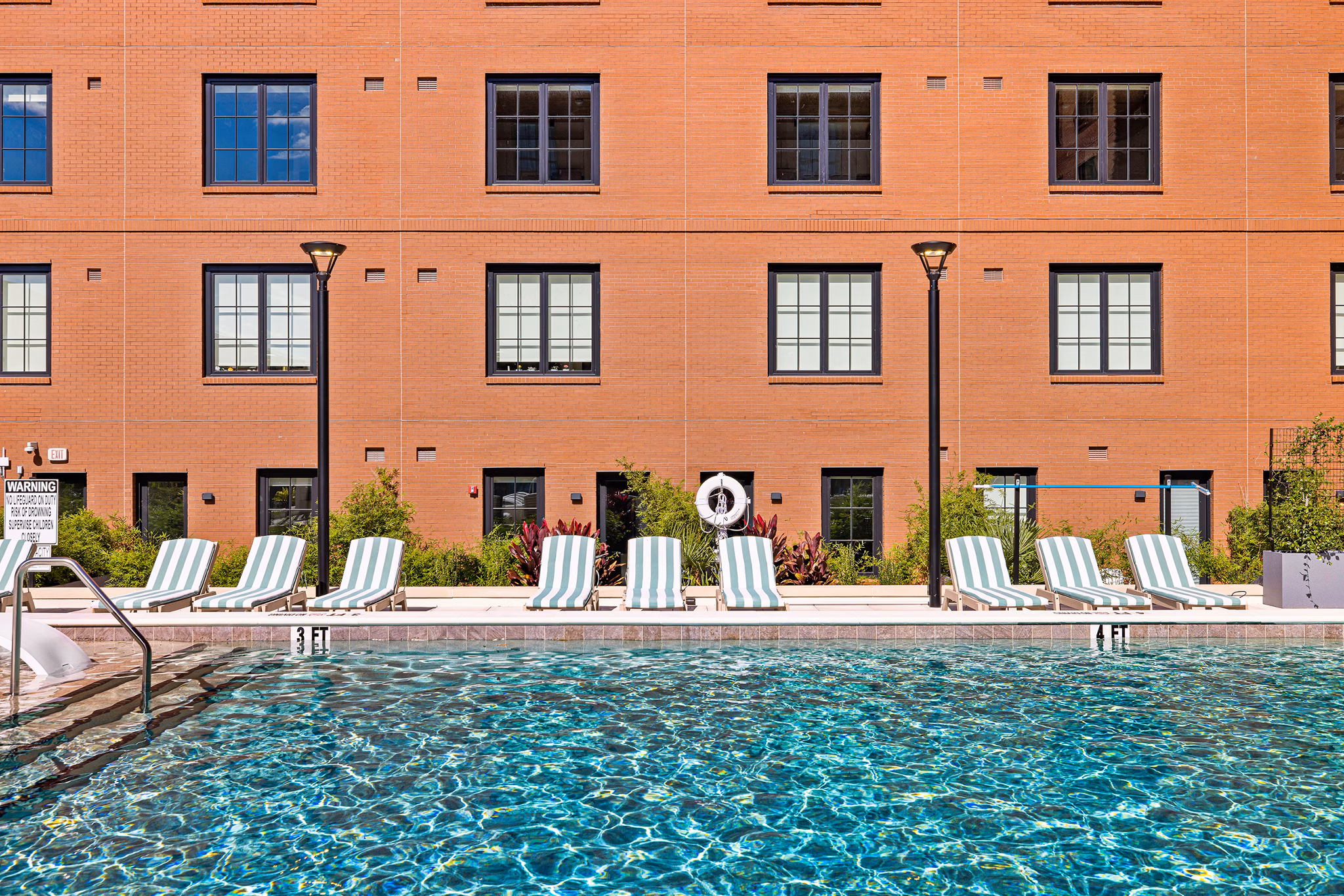 Luxury rooftop pool at Ann Street Lofts Apartments with city views