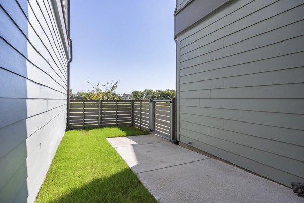 Cozy patio with modern furniture at Escalon Townhomes Apartments, perfect for outdoor relaxation and leisure activities