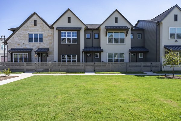 Escalon Townhomes Apartments: Elegant view of modern townhomes in a serene neighborhood setting