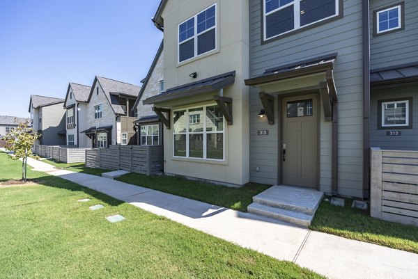 Escalon Townhomes: Charming view of suburban apartments, featuring landscaped gardens in a peaceful neighborhood