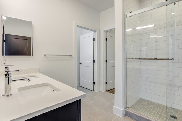 Bathroom with modern fixtures and elegant tiles in Escalon Townhomes Apartments