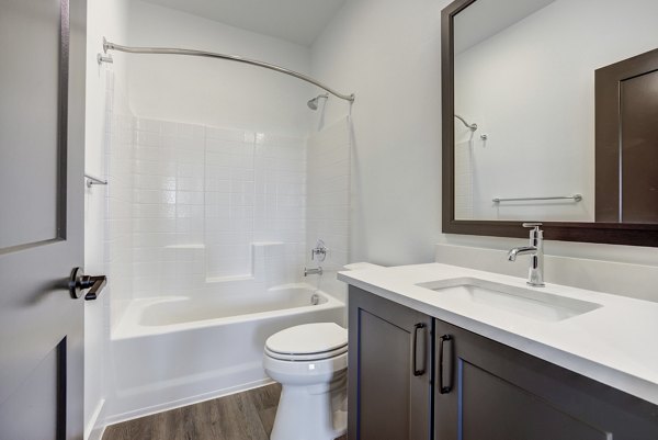 Spacious bathroom with modern fixtures at Escalon Townhomes Apartments