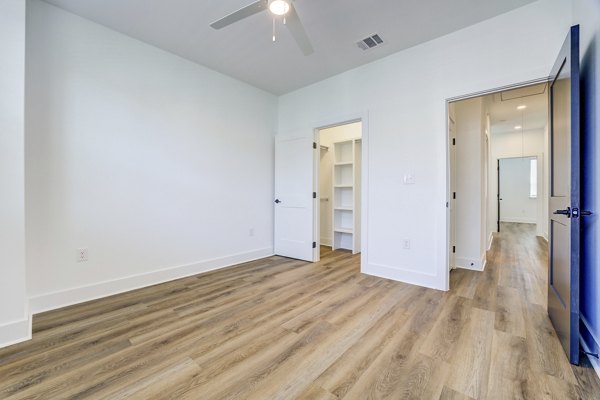 Clubhouse with modern design and comfy seating at Escalon Townhomes Apartments