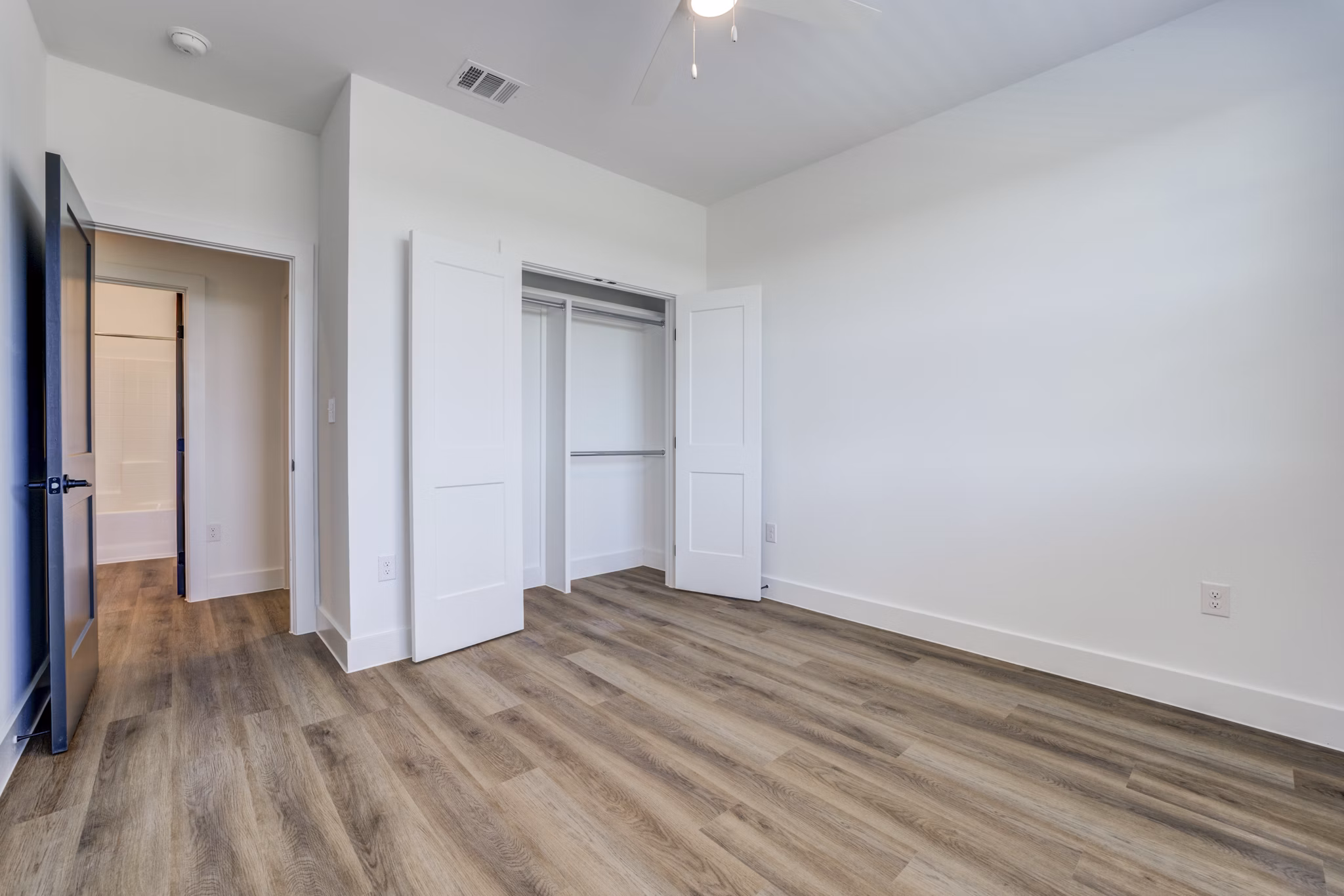 Modern clubhouse featuring cozy seating and billiards at Escalon Townhomes Apartments