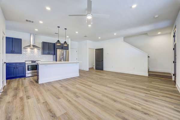 Modern kitchen with stainless steel appliances at Escalon Townhomes Apartments