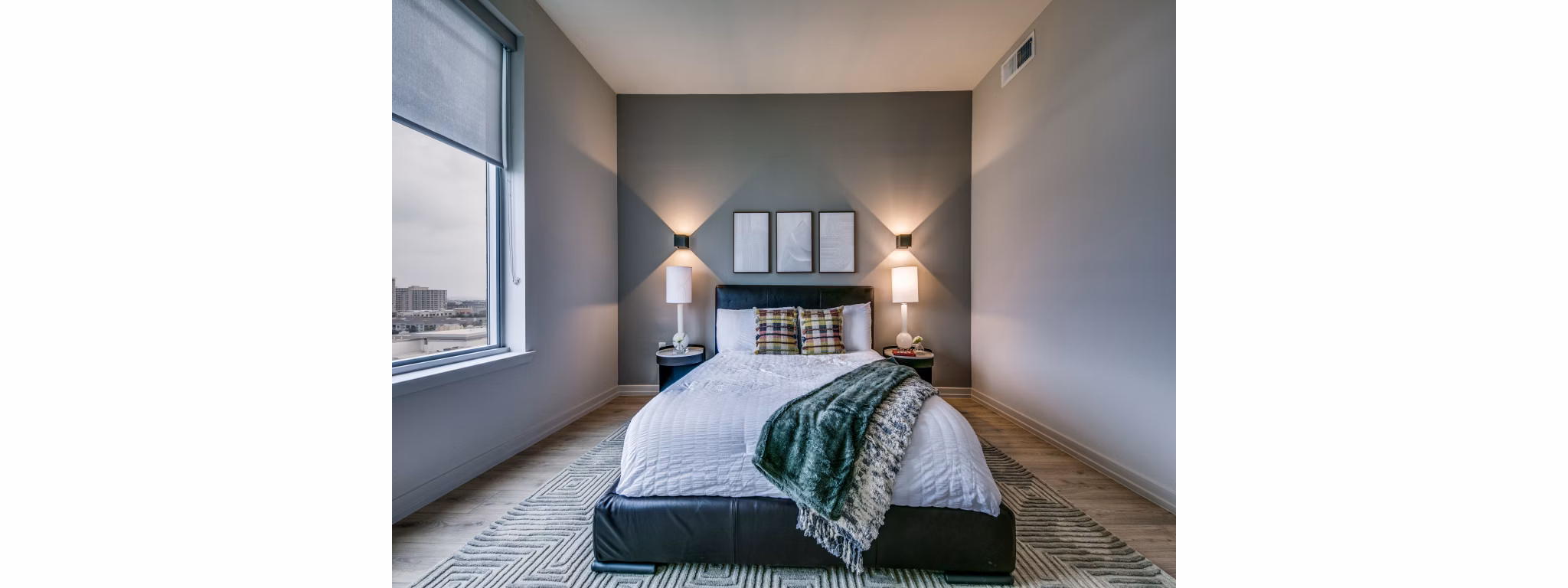 Bedroom featuring contemporary design and plush bedding at 3700M Apartments