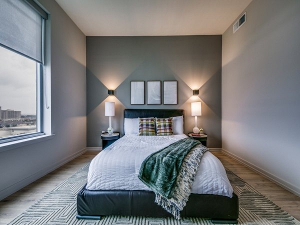 Bedroom featuring contemporary design and plush bedding at 3700M Apartments