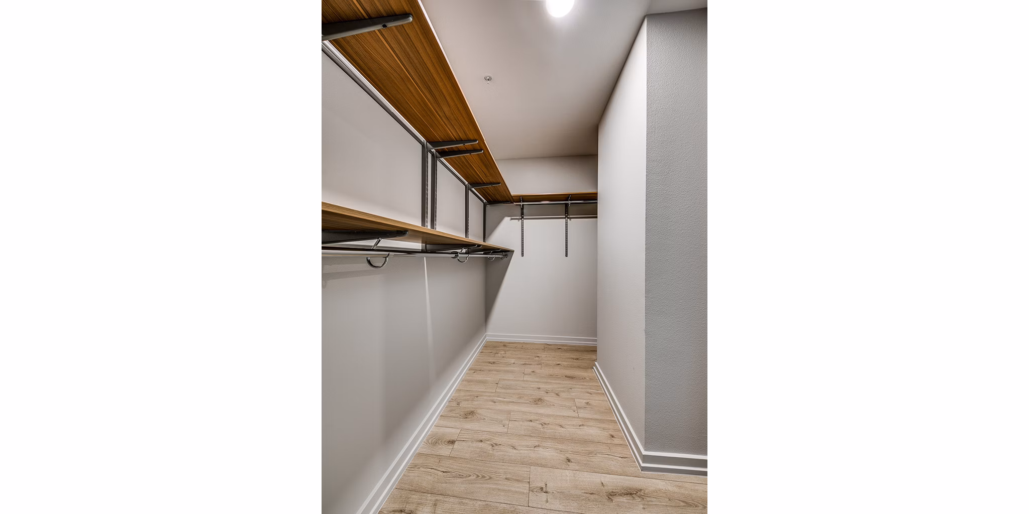 Spacious closet with built-in shelving at 3700M Apartments