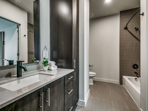 Modern bathroom with sleek fixtures at 3700M Apartments, a Greystar luxury property in a prime urban location