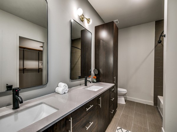Luxury bathroom with sleek fixtures at 3700M Apartments, showcasing modern design and comfort in urban living
