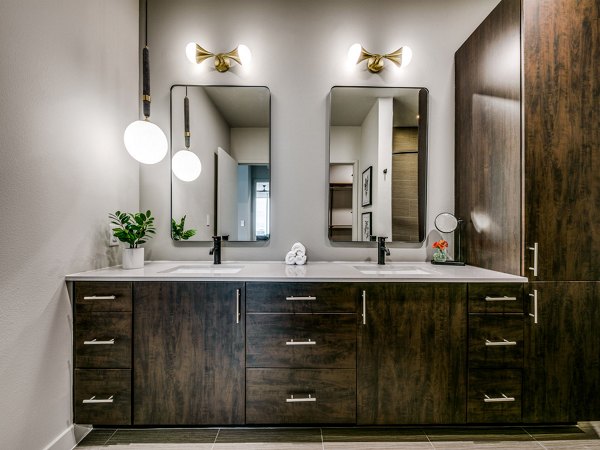 Luxury bathroom with marble countertops and modern fixtures at 3700M Apartments in the heart of Dallas