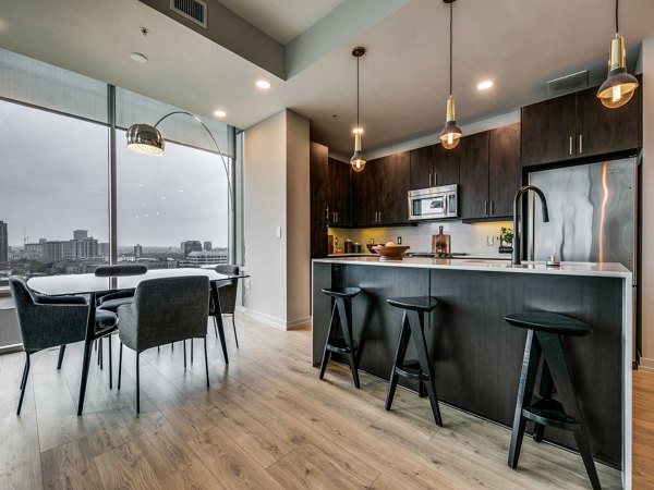 Modern dining area with stylish furnishings at 3700M Apartments, offering luxury living experiences in the heart of the city