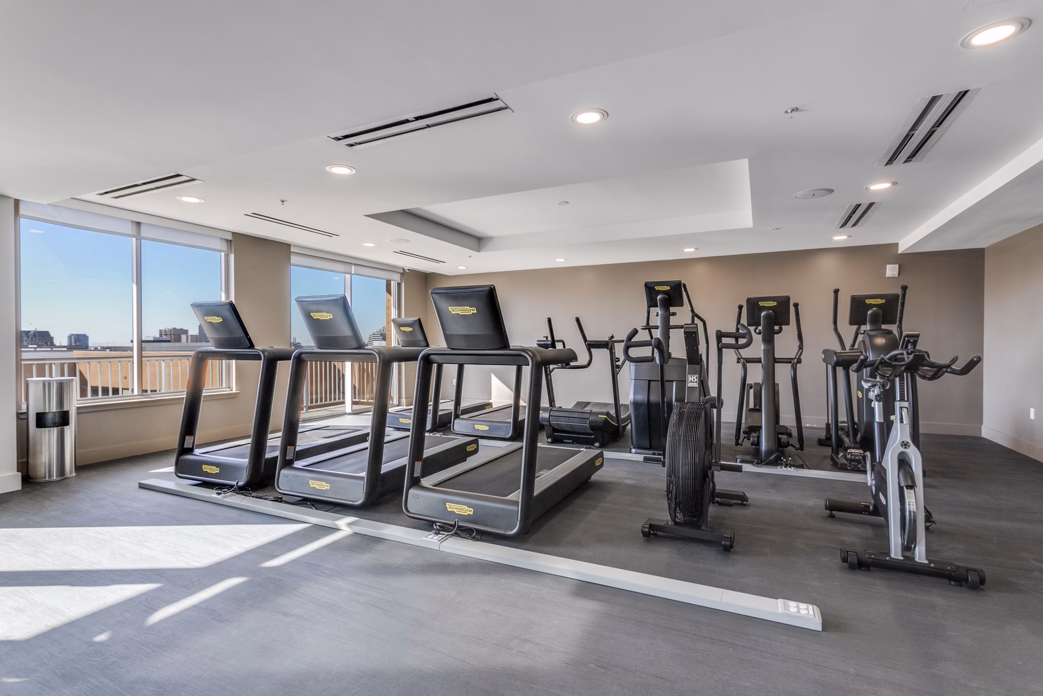 Modern fitness center with state-of-the-art equipment at 3700M Apartments, catering to a luxurious lifestyle in the heart of the city