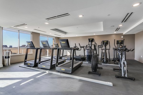 Modern fitness center with state-of-the-art equipment at 3700M Apartments, catering to a luxurious lifestyle in the heart of the city