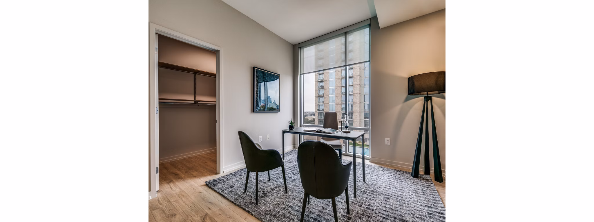 Home office with modern decor and abundant natural light in 3700M Apartments