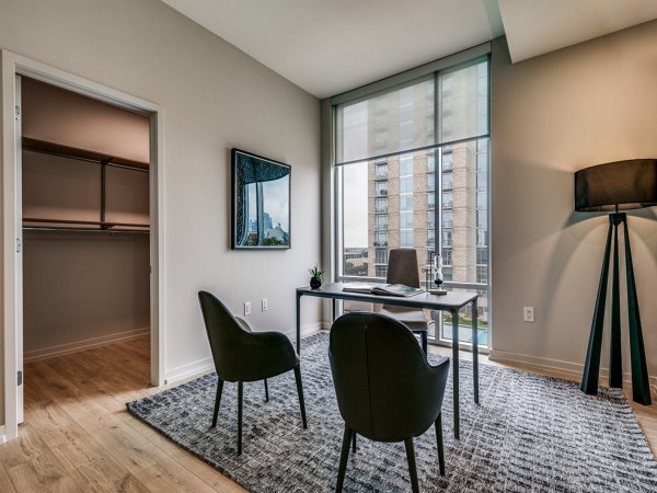 Home office with modern decor and abundant natural light in 3700M Apartments