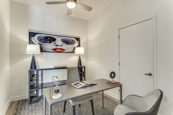 Home office with modern furnishings at 3700M Apartments in vibrant downtown setting