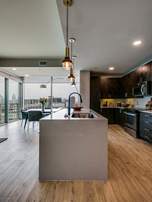 Modern kitchen with stainless steel appliances at 3700M Apartments, offering luxury living in a Greystar community